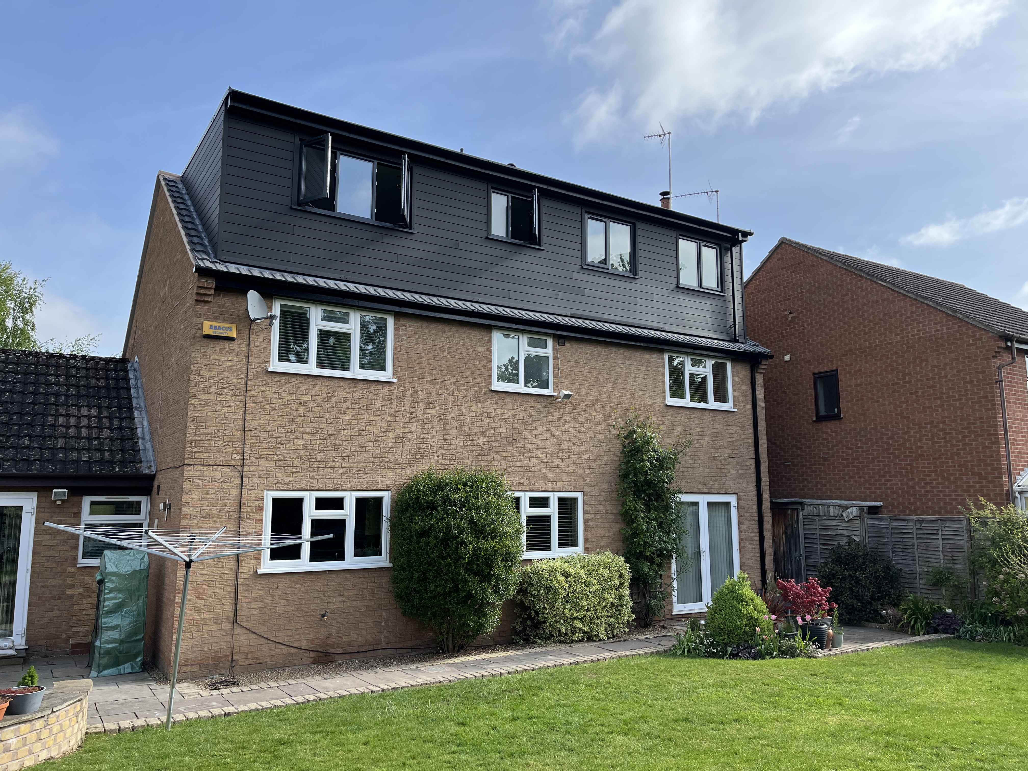 Completed loft conversion with dark cladding