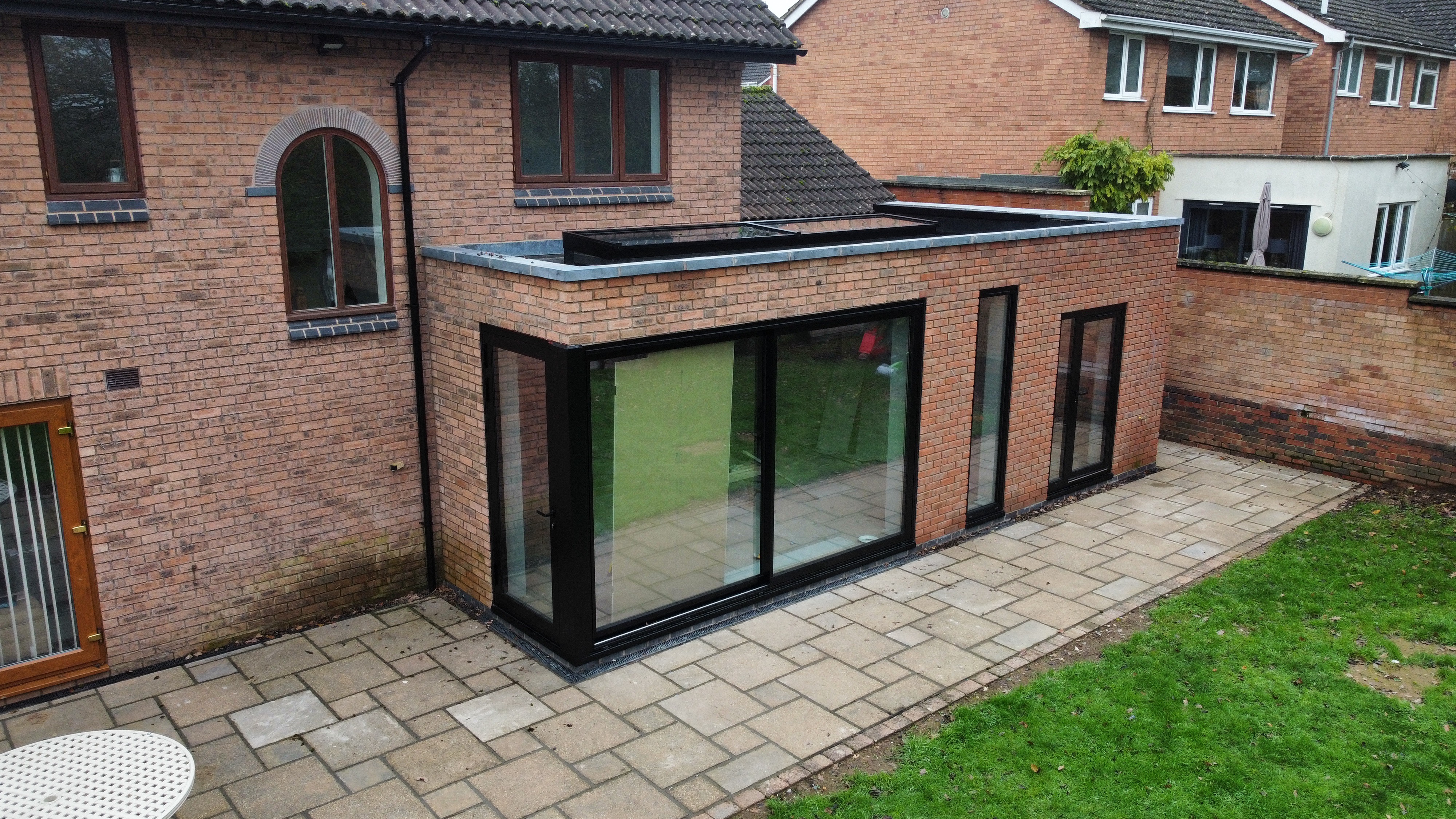 Aerial view — flat-roof extension with glazing